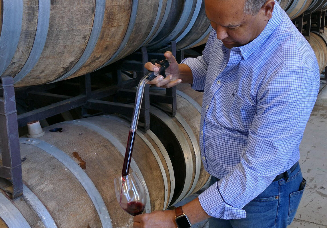 taking wine from the barrel